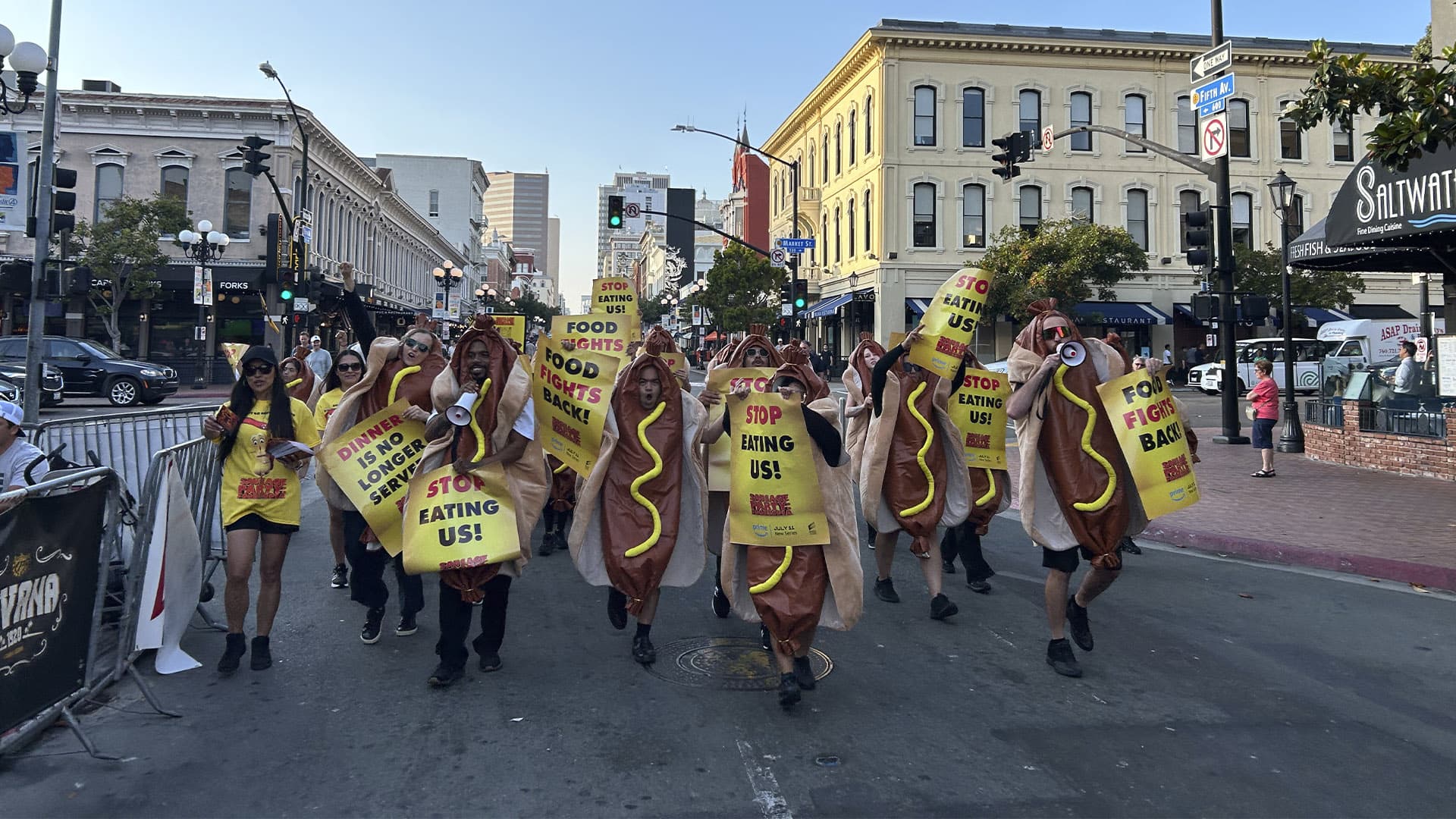 Crowd of food protesters carrying signs